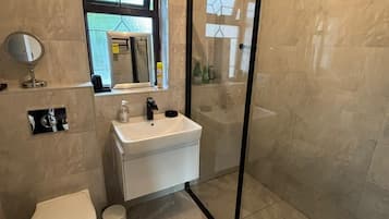 Shower, hair dryer, towels, soap
