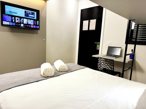 Minibar, desk, laptop workspace, blackout curtains