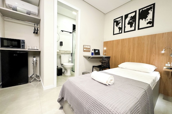 Economy Suite, Private Bathroom | Minibar, desk, laptop workspace, blackout drapes