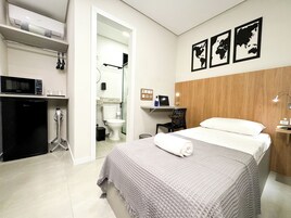 Economy Suite, Private Bathroom | Minibar, desk, laptop workspace, blackout drapes