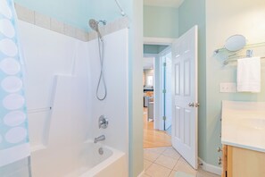 A bathroom with a shower, a sink, and a mirror. - New Listing | 0.1 Miles to Beach| Pool Access (Surf City)