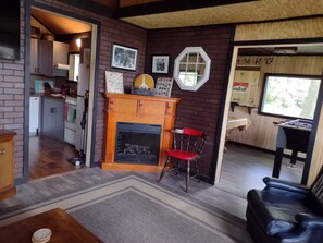 Smart TV, fireplace, foosball, books
