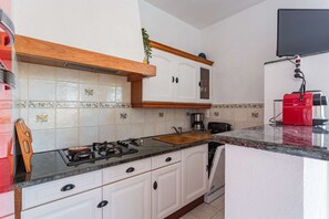 Fridge, oven, cookware/dishes/utensils