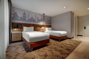 Roupas de cama premium, camas Tempur-Pedic, frigobar, cofres nos quartos