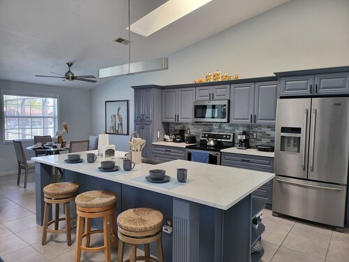 waterfront home, in a canal of the Caloosahatchee River with direct Gulf access.