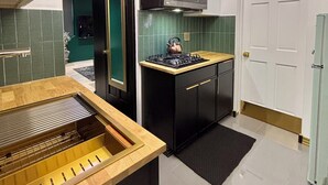 Fridge, microwave, stovetop, cookware/dishes/utensils