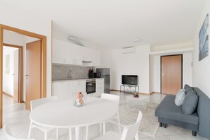 Living area - GuestHost - Cosy 60sqm flat with a private garden of 8sqm that can accommodate up to 4 people, located on the ground floor of a building with lift.The flat is only 500m from the Parco Nord, the largest green area in Milan!At 500m there is also the ‘Bru (Milano)