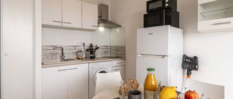 Fridge, microwave, cookware/dishes/utensils