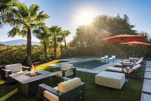 A backyard with a swimming pool, outdoor furniture, and a fire pit. - 4BR Desert Home: Free Heated Pool & Spa, Arcade Games, Fire Pit & Grill (Coachella)