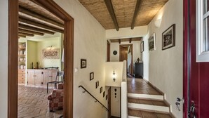 A staircase with wooden steps and white railings leading to a landing. - Rustic Retreat with Pool and Stunning Views (Altura)