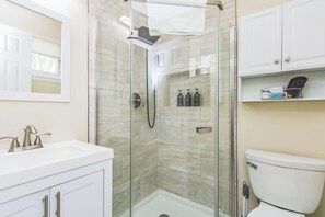 Shower, jetted tub, hair dryer, towels