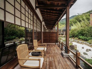 A traditional Japanese-style outdoor seating area with wooden flooring and tatami mat seating. - Jingdezhen Xingshan City outside Jielu (Jingdezhen)