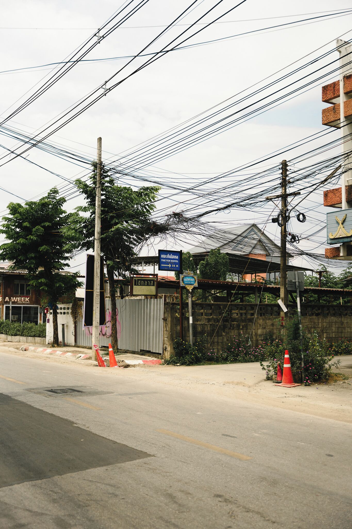 A street with a building that has a sign reading "Masala Restaurant."
