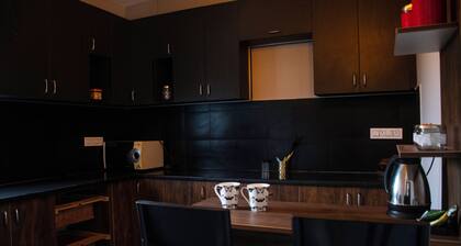 Enjoyable 3-bedroom apartment with WiFi in Bidadi for parties quiet stay