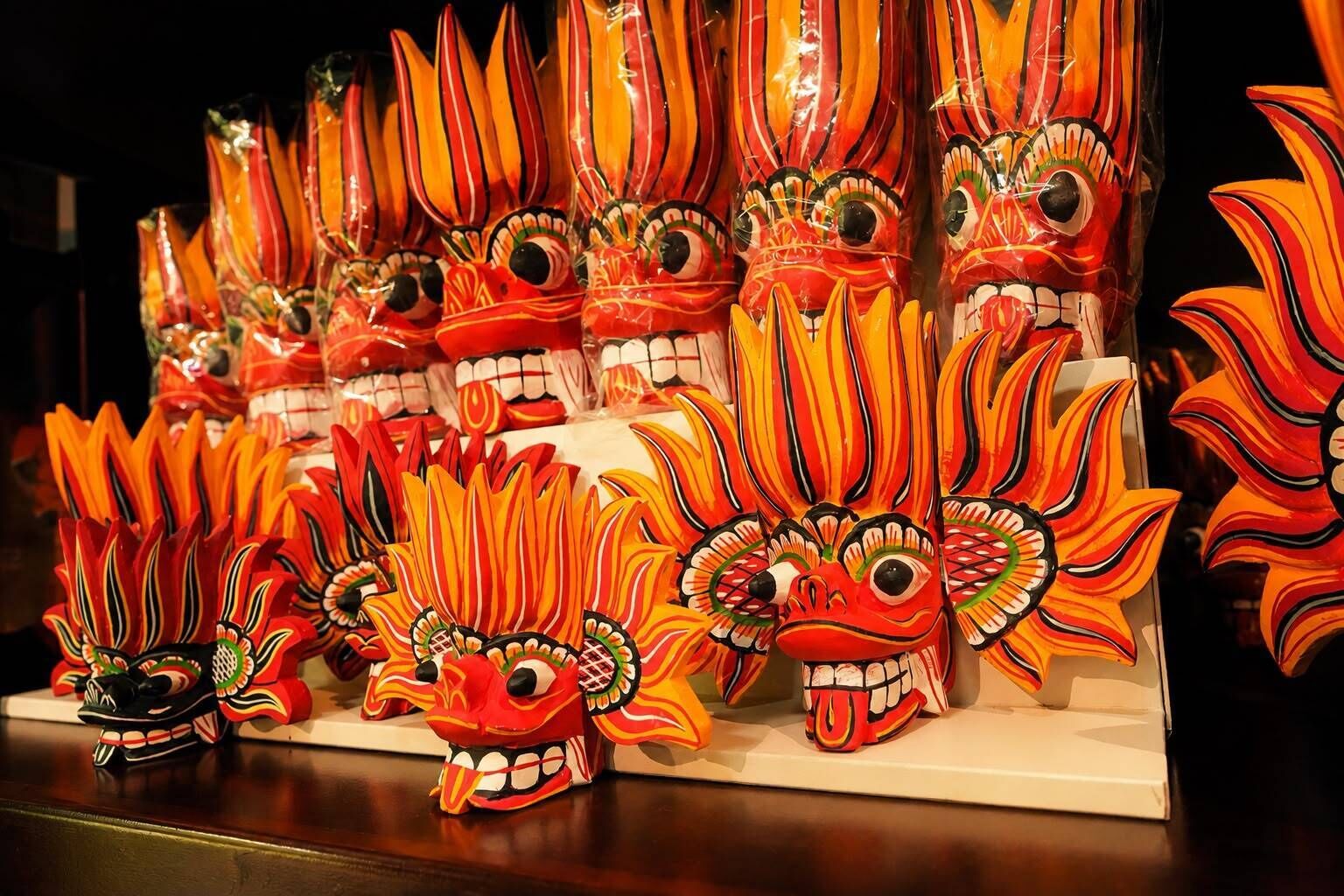 A display of traditional masks with vibrant colors and intricate designs.