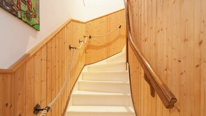 A wooden staircase with white steps and a rope handrail. - Holiday Home in Hermagor near Nassfeld Ski Area (Hermagor)