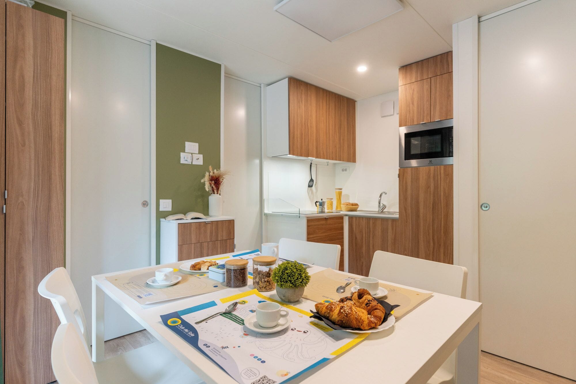 Full-sized fridge, high chair, cookware/dishes/utensils