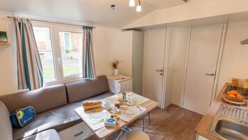 Lodge Standard | Living area | 24-inch flat-screen TV with digital channels