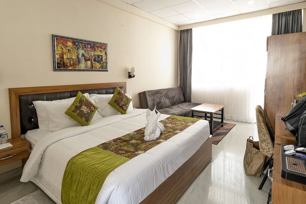 Super Deluxe Room | Desk, laptop workspace, blackout drapes, iron/ironing board