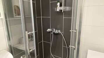 Shower, free toiletries, hair dryer, towels