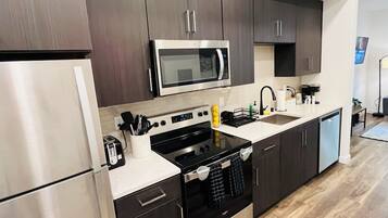 Microwave, stovetop, dishwasher, coffee/tea maker