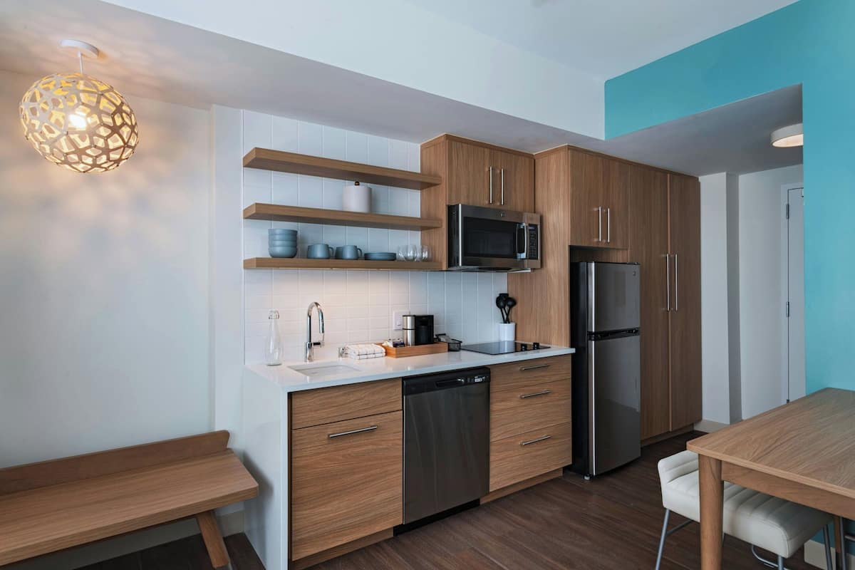 Desk, laptop workspace, blackout drapes, iron/ironing board