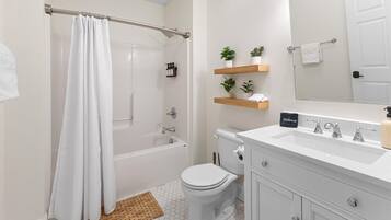 Shower, hair dryer, towels, shampoo