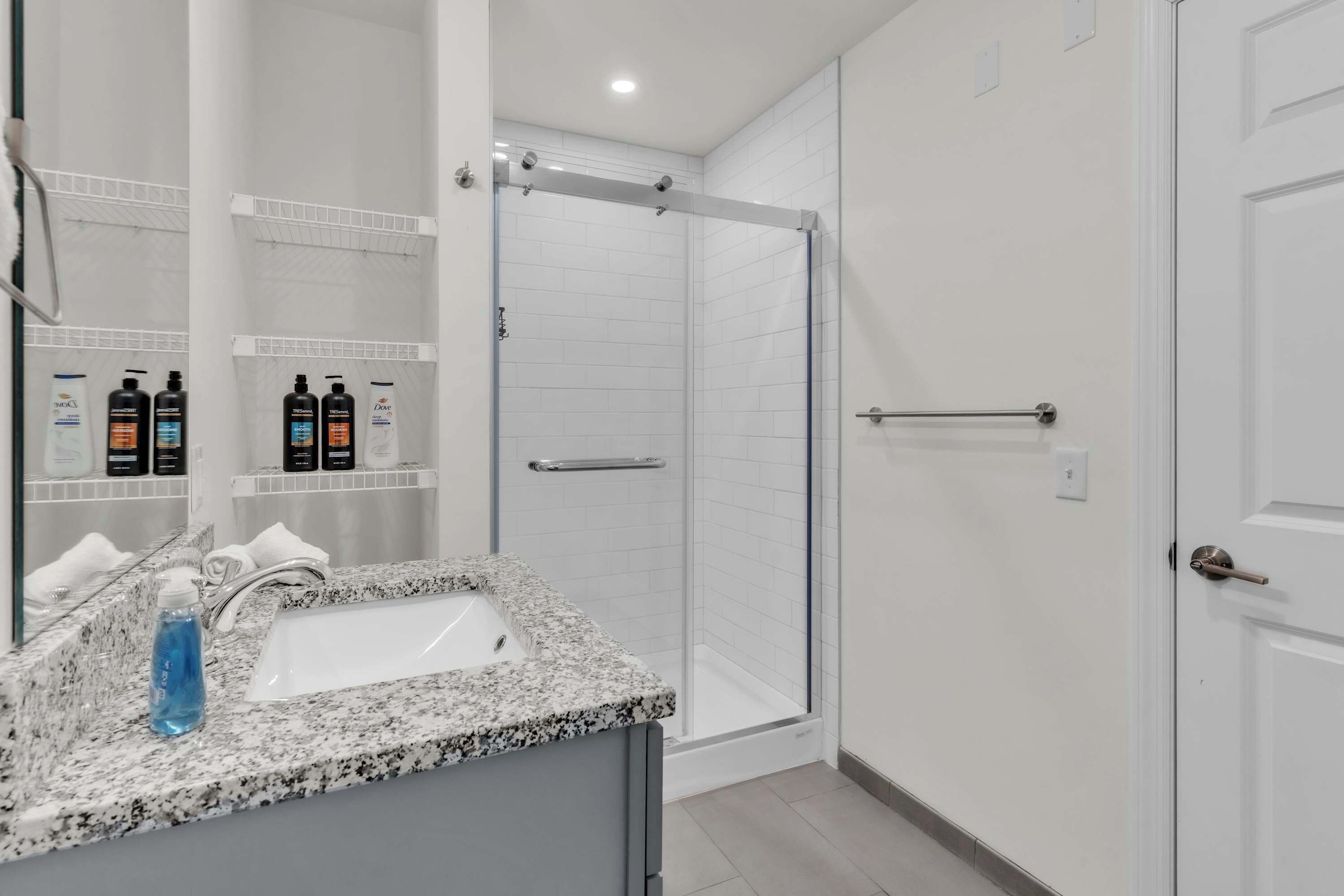 Shower, hair dryer, towels, shampoo