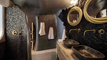 Deluxe Cave Villa with Private Dome Hot Tub, Caldera and Sunset View | Bathroom | Shower, hair dryer, towels, soap