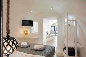 Deluxe Cave Villa with Private Dome Hot Tub, Caldera and Sunset View | Egyptian cotton sheets, premium bedding, individually decorated