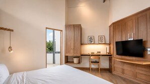 A bedroom with a bed, a desk, a chair, and a television. - BA Villa 9 1 BR Villa 800m to Echo bea Elegant 1-br Villa With Pool 800m to Echo Beach (Pererenan)