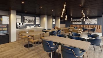 A modern restaurant with wooden tables and blue chairs, a bar area, and artwork on the walls.