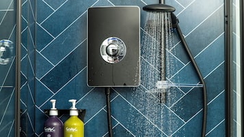 Shower, eco-friendly toiletries, hair dryer, towels