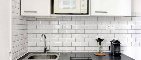 Fridge, microwave, stovetop, coffee/tea maker