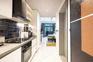 Fridge, microwave, stovetop, coffee/tea maker