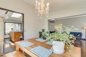 A modern kitchen with a wooden countertop, a sink, and a large window. - Fish, Swim & Hike: Waterfront Home in Longview! (Longview)