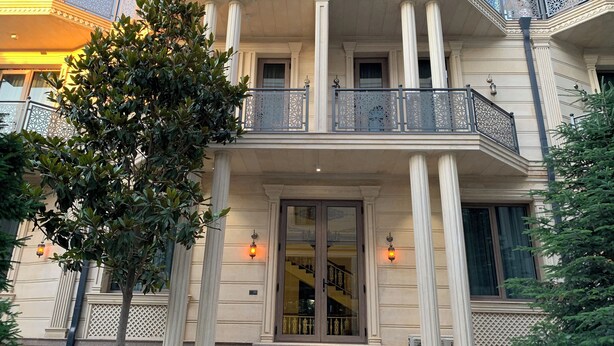 A two-story building with a balcony, columns, and a staircase leading to the entrance. - Nur Makan Hotel Tashkent (Tashkent)