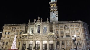 A historic building with a prominent clock tower and ornate facade. - Madonna della Neve (Rome)