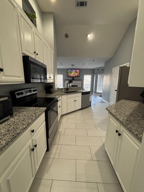 Microwave, oven, stovetop, dishwasher - Charming 3 bedroom 2 bath Home Oasis - Pool View, AC, and WiFi (Montgomery)