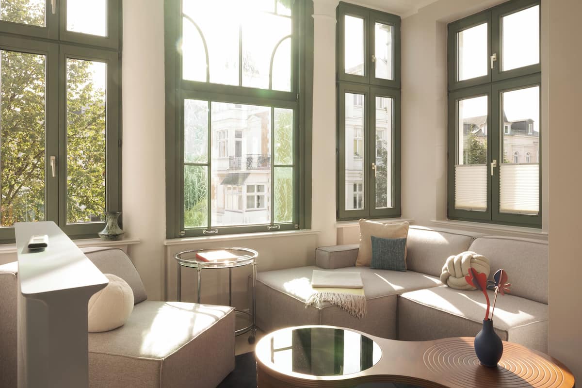 A modern living room with a sofa, a coffee table, and a small side table.
