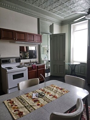 Fridge, stovetop, dishwasher, coffee/tea maker