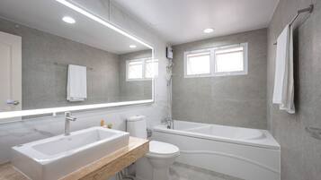Jetted bath, hair dryer, bidet, towels