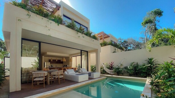 A modern house with a pool, outdoor seating, and lush greenery. - Jungle Villa Oasis, large private pool & Starlink (Tulum)