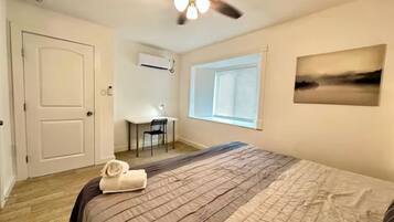 1 bedroom, desk, iron/ironing board, travel crib