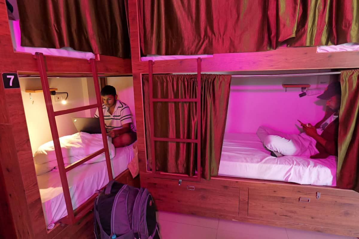10-Bed Mixed Dormitory Room | Premium bedding, down comforters, Select Comfort beds, laptop workspace