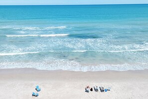 On the beach, sun loungers, beach towels