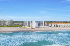 On the beach, sun loungers, beach towels