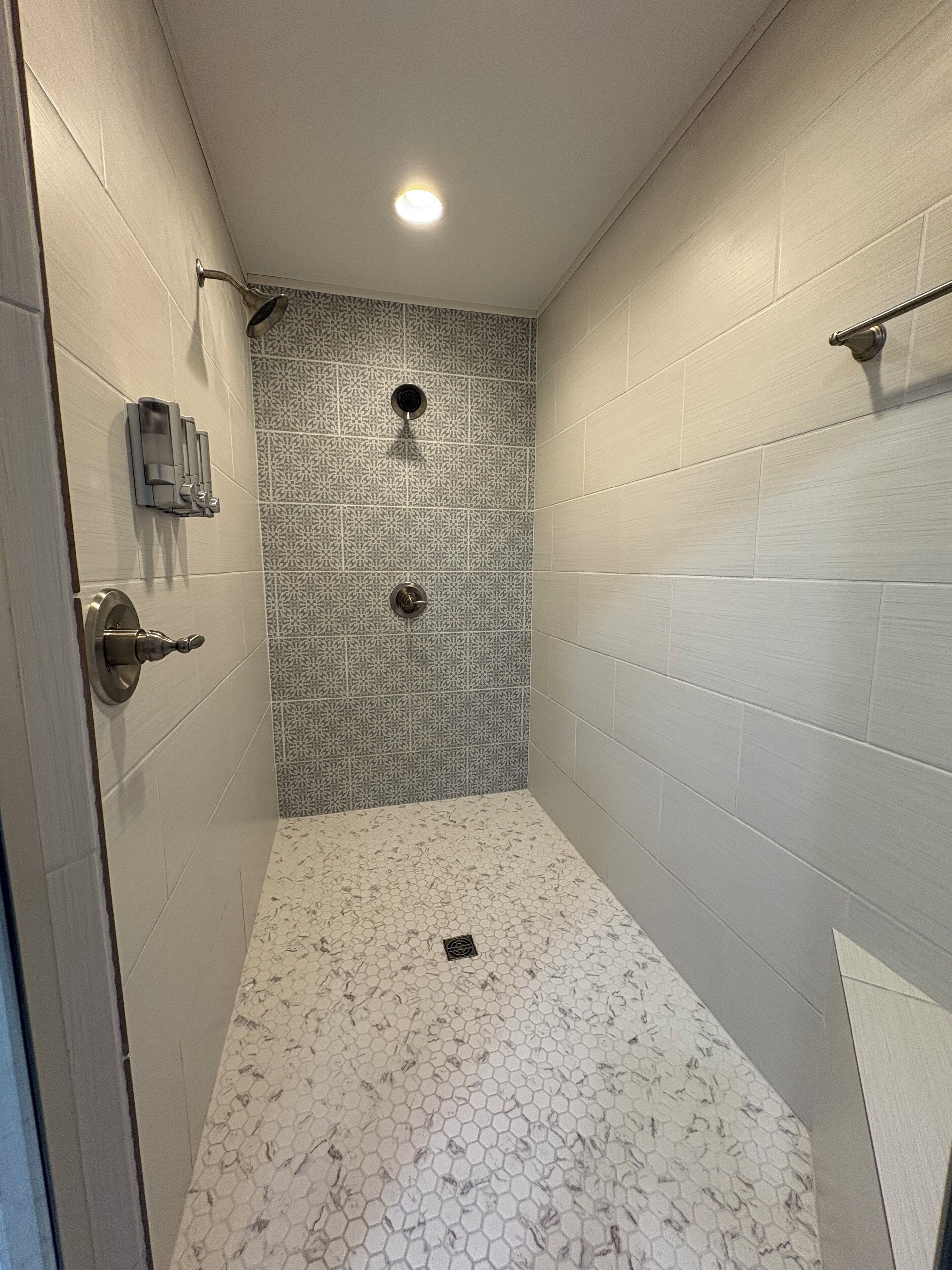 Shower, hair dryer, towels, toilet paper