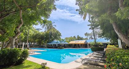 Serene condo with ocean views, modern amenities & pool access