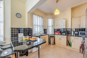 Fridge, microwave, oven, cookware/dishes/utensils